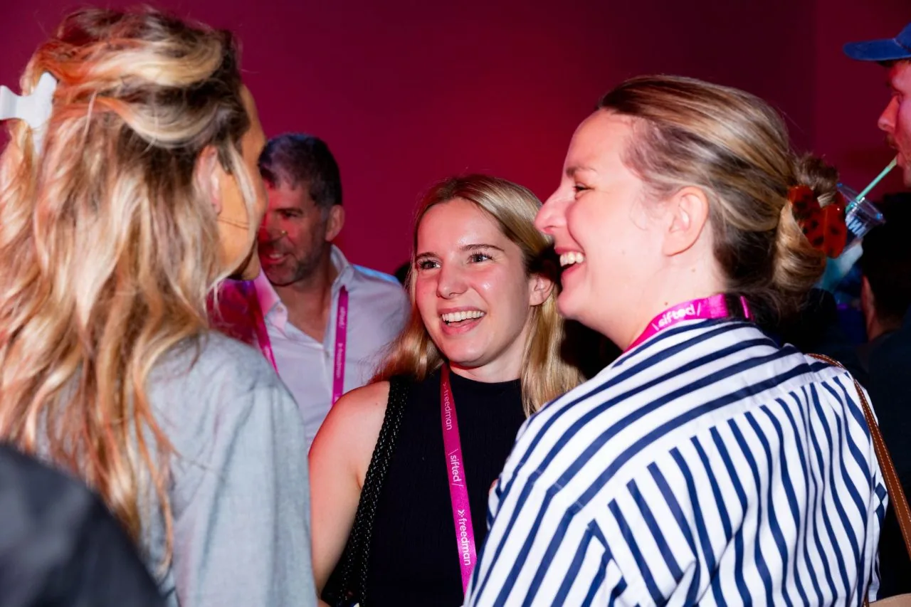 Attendees chatting at the Sifted Summit 2026 evening event